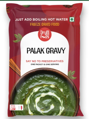 Red DryM Foods Palak Gravy packet showing a bowl of green gravy